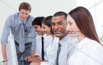 Enthusiastic business team working at computer
