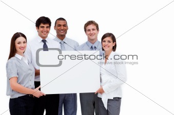 Multi-ethnic business people holding a white card 