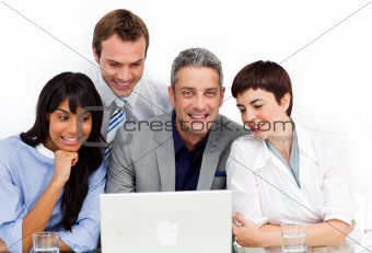 A diverse business group using a laptop 