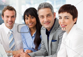 Multi-ethnic business partners looking at the camera 