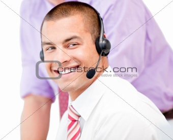 Portrait of a smiling businessman with headset on 