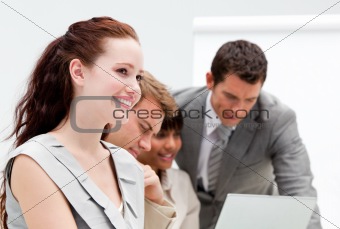 Confident business partners working at a computer in the office