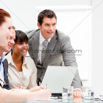 Portrait of anice businesswoman working with her colleagues 