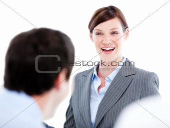 Portrait of a laughing businesswoman talking at her colleague du
