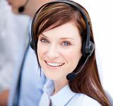 Portrait of caucasian businesswoman with headset on 