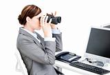 Nice businesswoman using binoculars 