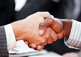 Close-up of a handshake between two businessmen