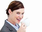 Portrait confident businesswoman drinking a cup of coffee agains