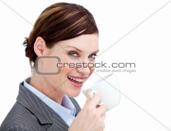 Portrait confident businesswoman drinking a cup of coffee agains