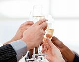 Close-up of businessmen celebrating an event with champagne