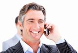 Happy businessman talking on the phone 