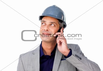 Charming male architect on phone looking up 
