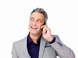 Laughing Businessman on phone looking up 