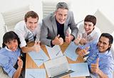 High angle of a cheerful business team with thumbs up