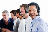 Smiling business people working in a call center
