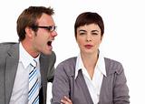 Angry businessman shouting into his colleague's ear 