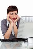 Bored businesswoman looking at her computer 