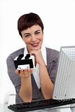Glowing businesswoman holding a business card holder