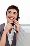 Radiant Businesswoman on phone at her desk