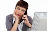 Attractive Businesswoman on phone at her desk 