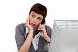Young Businesswoman on phone at her desk 