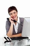 Enthusiastic businesswoman holding a telephone