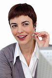 Assertive businesswoman with headset on 