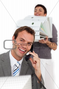 Businesswoman bringing a lot of work to her colleague