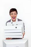 Radiant businesswoman putting a pile of folders on a desk 