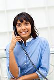 Charming ethnic businesswoman on phone 
