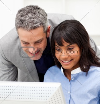 Mature Manager checking his employee's work