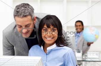Mature businessman helping his colleague 