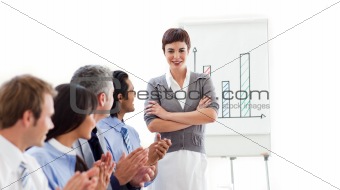 Multi-ethnic business partners applauding a good presentation 