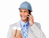 Confident businessman wearing a hardhat on phone