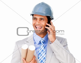 Confident businessman wearing a hardhat on phone