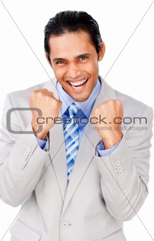 Attractive businessman punching the air celebrating a victory