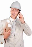 Positive male architect talking on phone 
