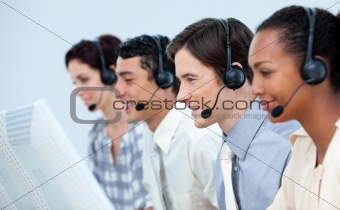 Concentrated business people using headset 