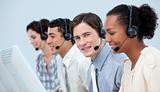 Confident customer service representatives with headset on