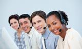 Smiling business people using headset 