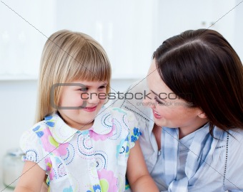 Portrait of a cheerful mother and her cute little girl