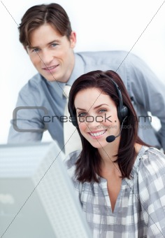 Brunette businesswoman helping by her manager