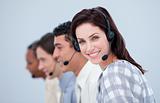 Attractive business woman and her team working in a call center