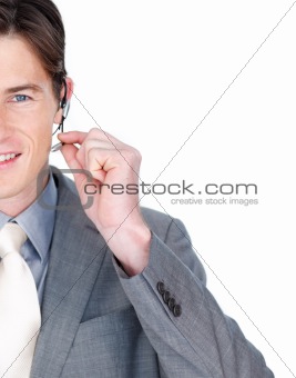 Close-up of a businessman talking on a headset