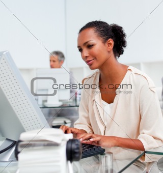 Concentrated businesswoman working at a computer