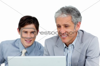 Concentrated businessmen working at a computer 