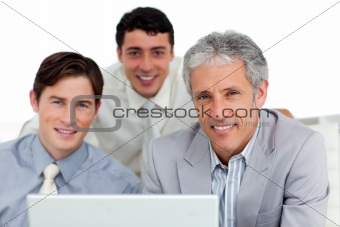 Self-assured business partners working at a computer 