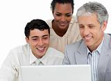 Positive business partners working at a computer 