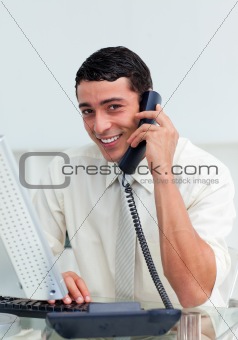 Positive businessman talking on phone 