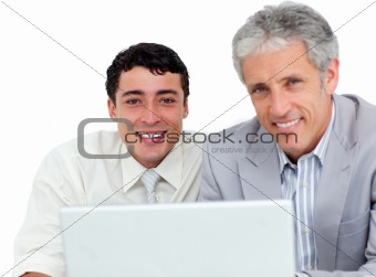 Self-assured business co-workers using a laptop